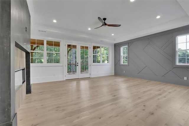 3903 Indian Shoals Rd SE, Bethlehem, GA 30620 - unfurnished room featuring light wood-style flooring, ceiling fan, french doors, recessed lighting, and a fireplace