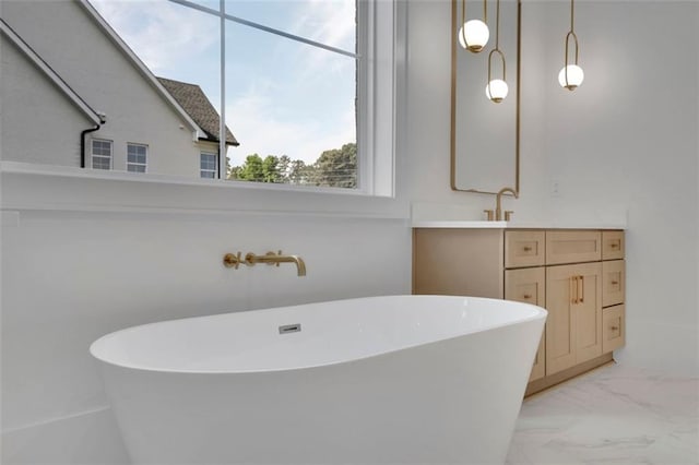 3903 Indian Shoals Rd SE, Bethlehem, GA 30620 - full bathroom featuring marble look tile flooring, a freestanding tub, and vanity