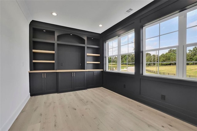 3903 Indian Shoals Rd SE, Bethlehem, GA 30620 - empty room with light wood finished floors, built in features, and recessed lighting