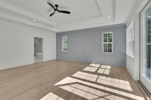 3903 Indian Shoals Rd SE, Bethlehem, GA 30620 - empty room with a tray ceiling, light wood-style floors, healthy amount of natural light, and recessed lighting