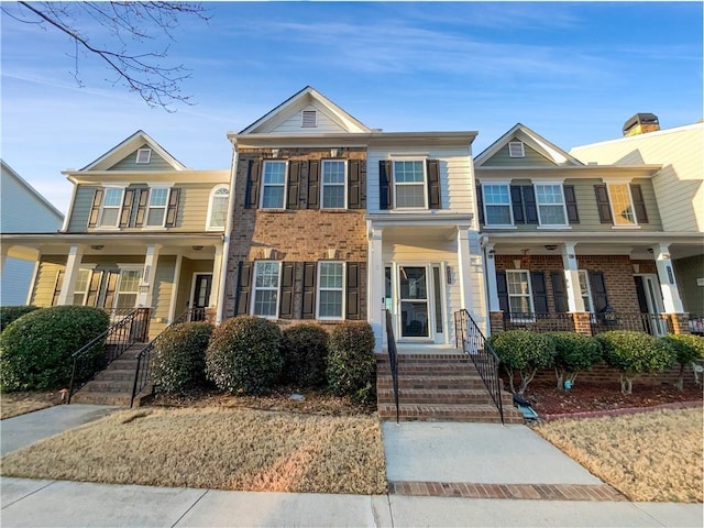 1235 Park Pass Way, Suwanee, GA 30024 - view of front facade with covered porch and brick siding