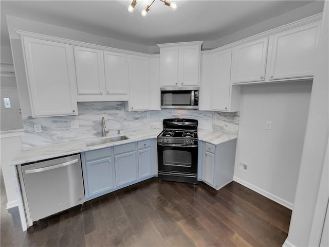 kitchen featuring white cabinets, dark wood-style flooring, stainless steel appliances, and a sink