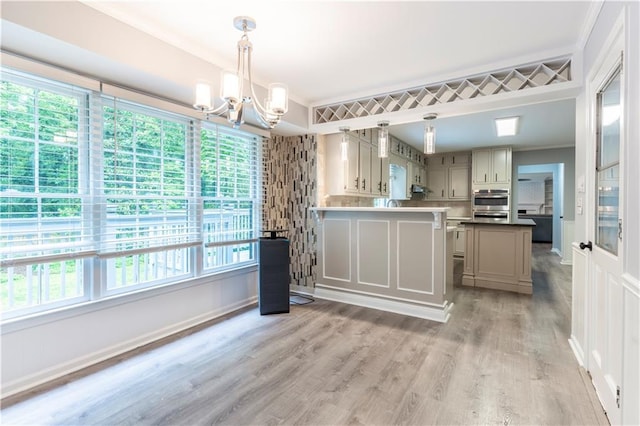 kitchen with a chandelier, light wood-style flooring, pendant lighting, and gray cabinetry