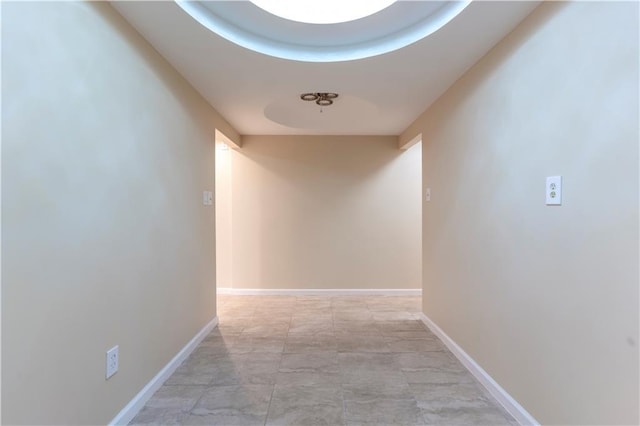 hallway featuring baseboards