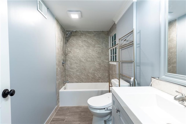 full bathroom featuring tub / shower combination, vanity, toilet, and wood finished floors