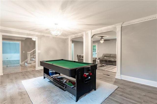 playroom featuring wood finished floors, arched walkways, billiards, a chandelier, and baseboards