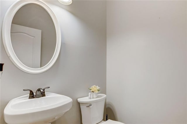 bathroom with sink and toilet