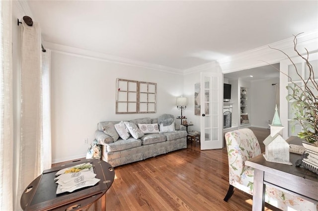 living room featuring french doors, wood finished floors, and crown molding