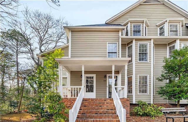 view of front of house featuring stairs and covered porch