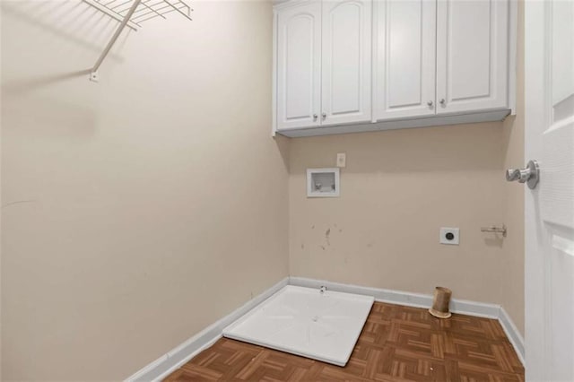 washroom featuring cabinets, hookup for an electric dryer, hookup for a washing machine, and dark parquet floors