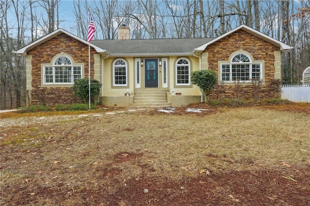 ranch-style house featuring a front yard