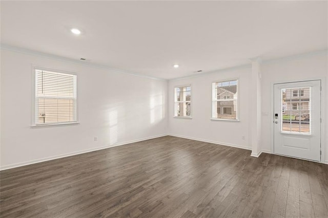 1159 Blue Juniper Cir, Loganville, GA 30052 - empty room with crown molding, dark wood finished floors, baseboards, and recessed lighting
