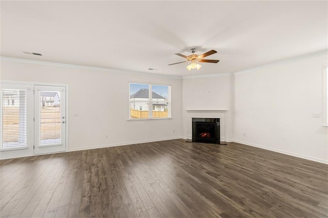 1159 Blue Juniper Cir, Loganville, GA 30052 - unfurnished living room with a ceiling fan, plenty of natural light, dark wood finished floors, and crown molding