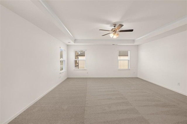 1159 Blue Juniper Cir, Loganville, GA 30052 - carpeted spare room with a raised ceiling, a ceiling fan, and baseboards