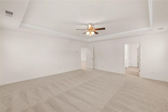 1159 Blue Juniper Cir, Loganville, GA 30052 - spare room with a raised ceiling, carpet floors, a ceiling fan, and baseboards