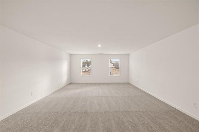 1159 Blue Juniper Cir, Loganville, GA 30052 - spare room featuring light carpet and baseboards