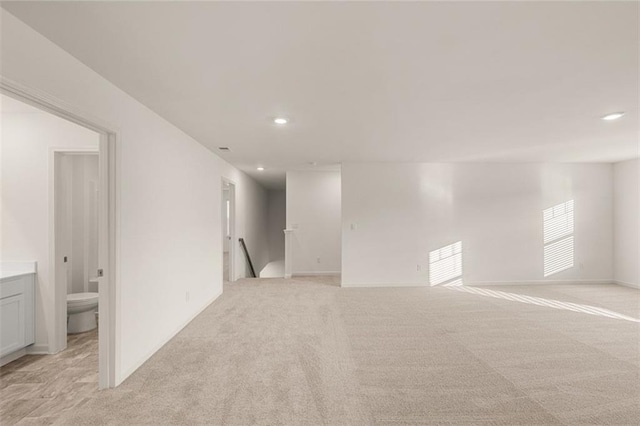1159 Blue Juniper Cir, Loganville, GA 30052 - spare room featuring light carpet, recessed lighting, and baseboards