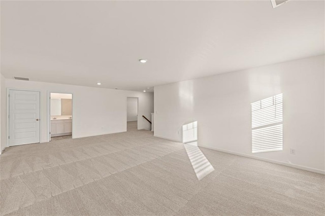 1159 Blue Juniper Cir, Loganville, GA 30052 - empty room featuring light colored carpet, recessed lighting, and baseboards