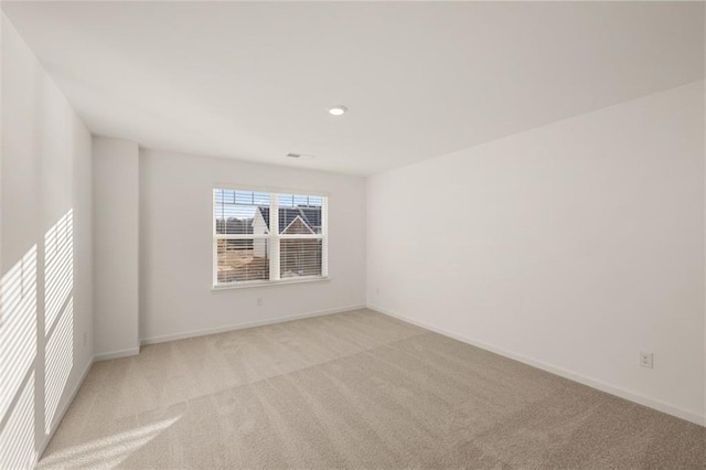 1159 Blue Juniper Cir, Loganville, GA 30052 - spare room featuring light carpet and baseboards