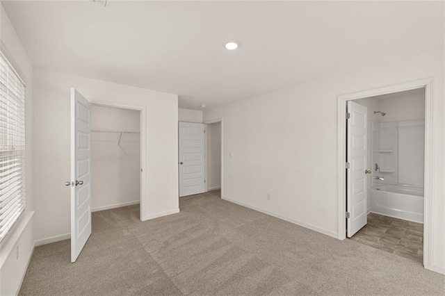 1159 Blue Juniper Cir, Loganville, GA 30052 - unfurnished bedroom featuring carpet floors, multiple windows, baseboards, a spacious closet, and recessed lighting