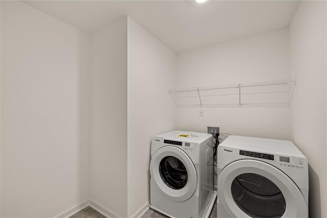 1159 Blue Juniper Cir, Loganville, GA 30052 - laundry room with washing machine and dryer and baseboards