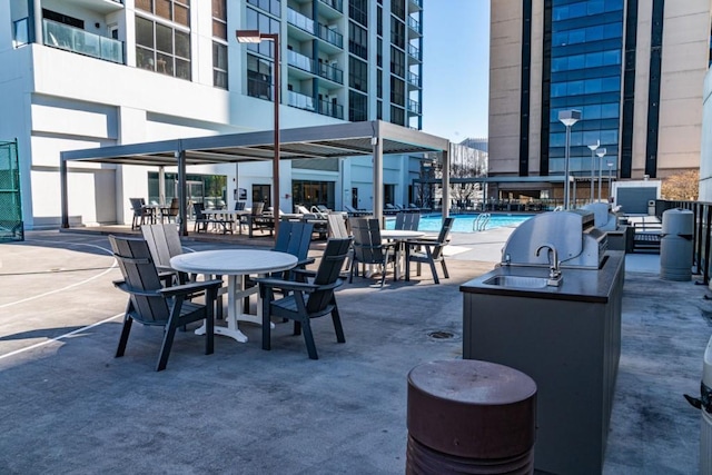 view of patio featuring a community pool