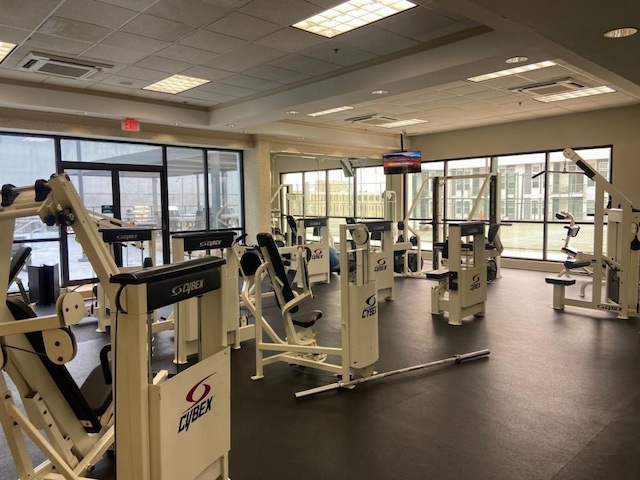 exercise room featuring visible vents and a paneled ceiling