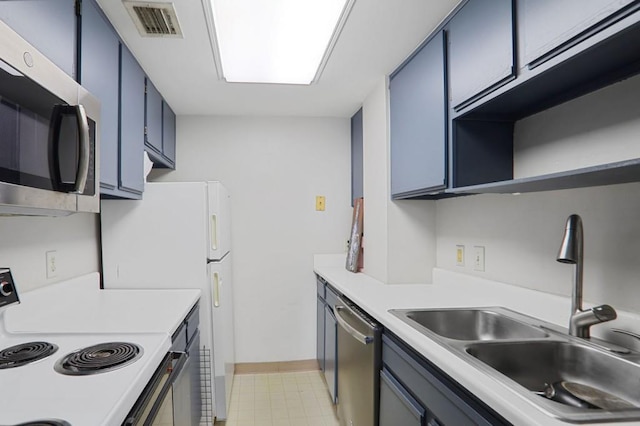 kitchen with visible vents, light countertops, stainless steel appliances, blue cabinets, and a sink