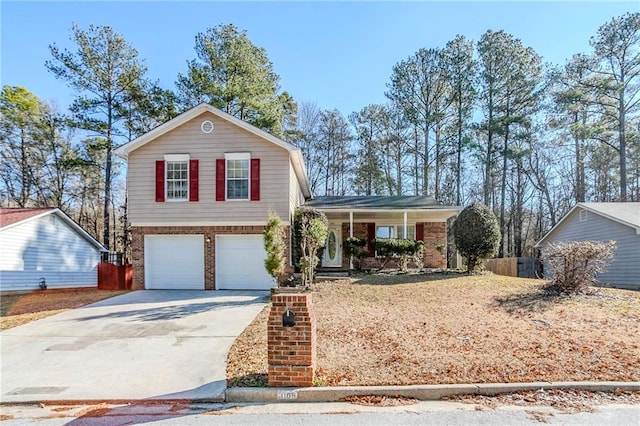 view of front of house featuring a porch and a garage