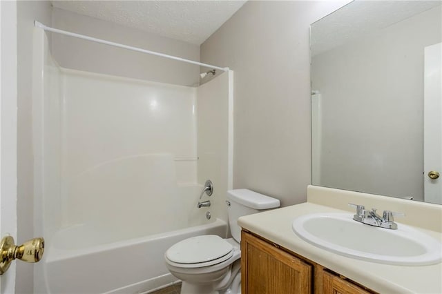 full bathroom featuring shower / bathtub combination, vanity, a textured ceiling, and toilet