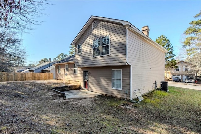 back of property featuring a patio and central air condition unit