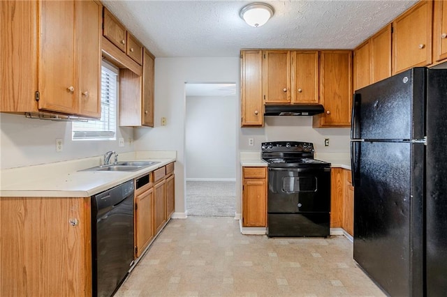 kitchen with a textured ceiling, sink, and black appliances