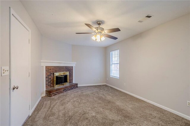 unfurnished living room featuring carpet, ceiling fan, and a fireplace