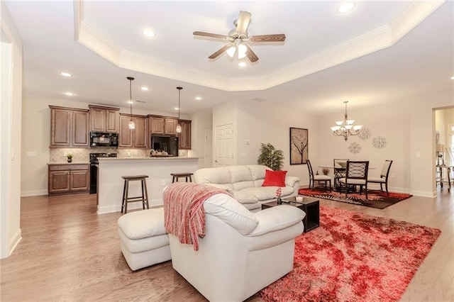 1555 Water Vista Ct Unit 4102, Cumming, GA 30041 - living room featuring a tray ceiling, light wood-style flooring, recessed lighting, crown molding, and ceiling fan