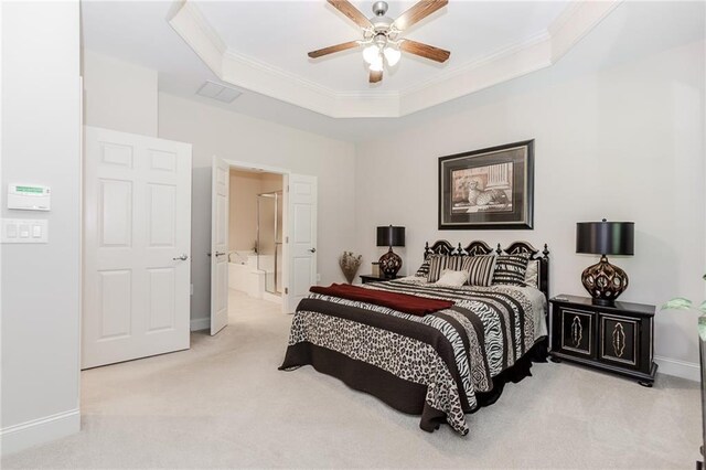 1555 Water Vista Ct Unit 4102, Cumming, GA 30041 - carpeted bedroom with a raised ceiling, ornamental molding, baseboards, ceiling fan, and connected bathroom