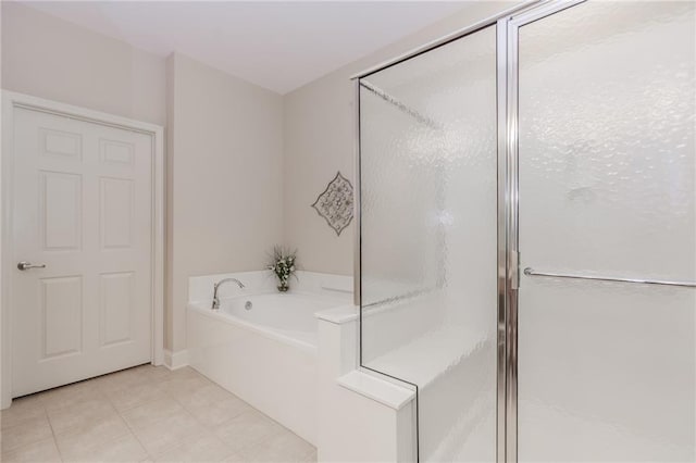 1555 Water Vista Ct Unit 4102, Cumming, GA 30041 - bathroom featuring a garden tub, a shower stall, and tile patterned floors
