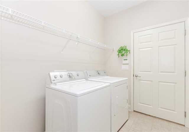 1555 Water Vista Ct Unit 4102, Cumming, GA 30041 - washroom with washing machine and clothes dryer and light tile patterned floors