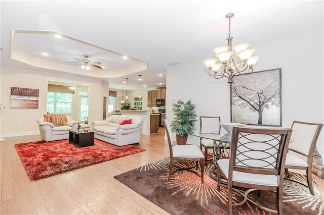 1555 Water Vista Ct Unit 4102, Cumming, GA 30041 - dining area featuring a raised ceiling, a chandelier, light wood finished floors, recessed lighting, and ceiling fan