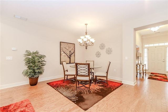 1555 Water Vista Ct Unit 4102, Cumming, GA 30041 - dining area with wood finished floors, a chandelier, and baseboards