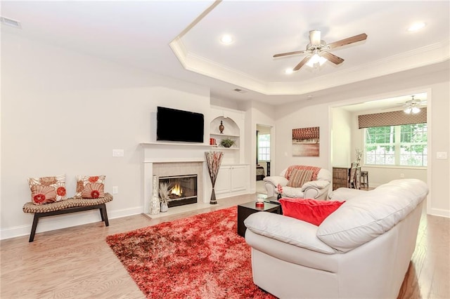 1555 Water Vista Ct Unit 4102, Cumming, GA 30041 - living area featuring ornamental molding, a ceiling fan, a tray ceiling, light wood finished floors, and recessed lighting