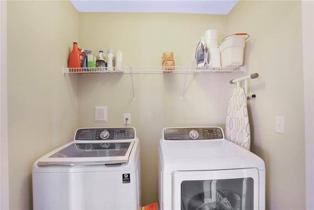 laundry room featuring laundry area and washing machine and dryer