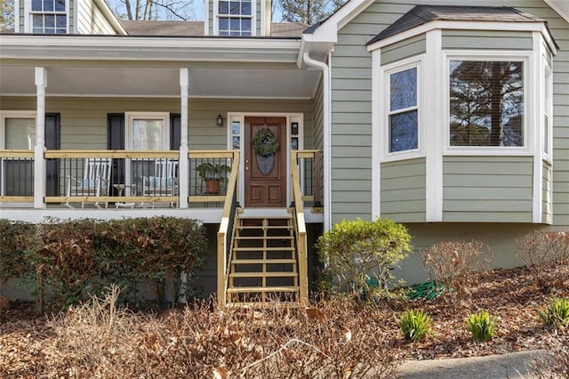 property entrance featuring covered porch