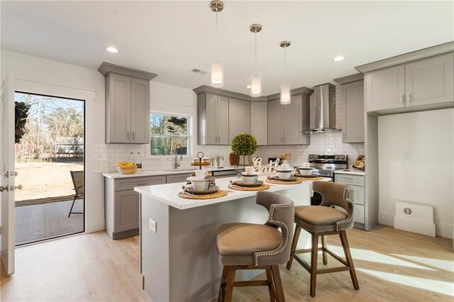 modern farmhouse style home featuring central air condition unit, a porch, and a front lawn