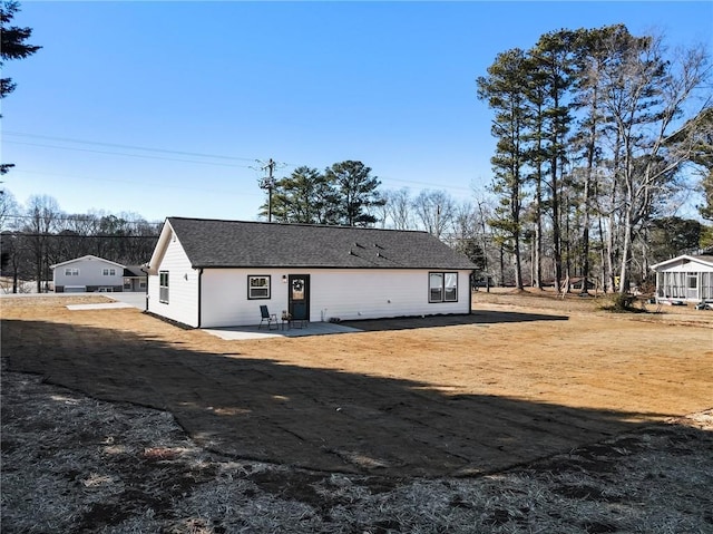 view of yard with a swimming pool, a storage shed, and a patio