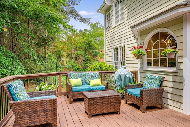 wooden deck with an outdoor hangout area