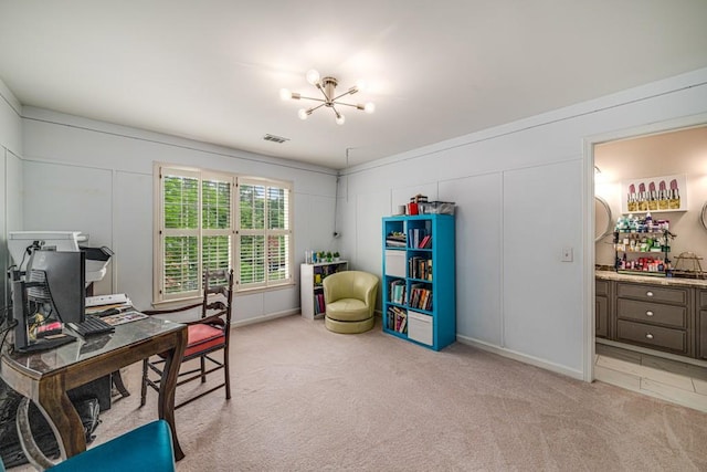 office with a chandelier, light colored carpet, and a decorative wall