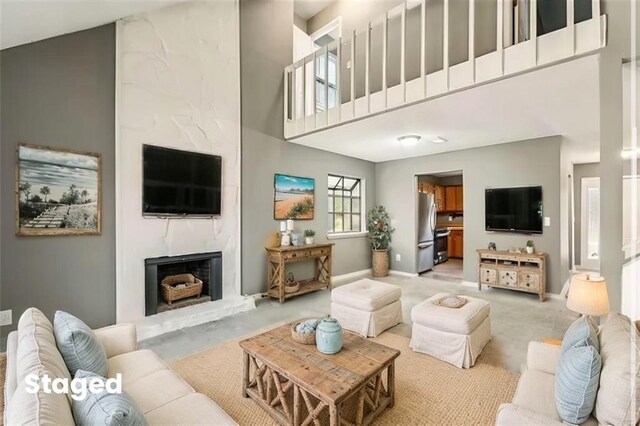 hall featuring light hardwood / wood-style floors and a textured ceiling