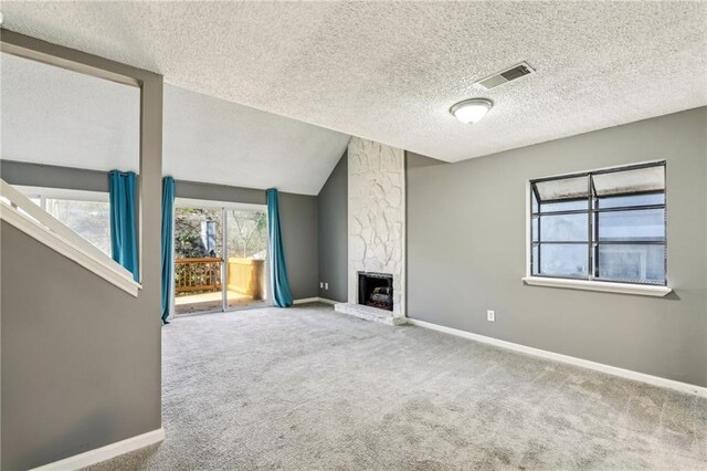 unfurnished living room featuring a towering ceiling, carpet floors, and sink