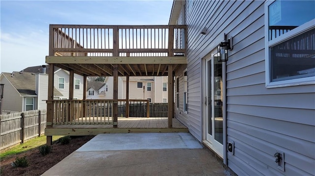 view of patio / terrace featuring a deck and fence