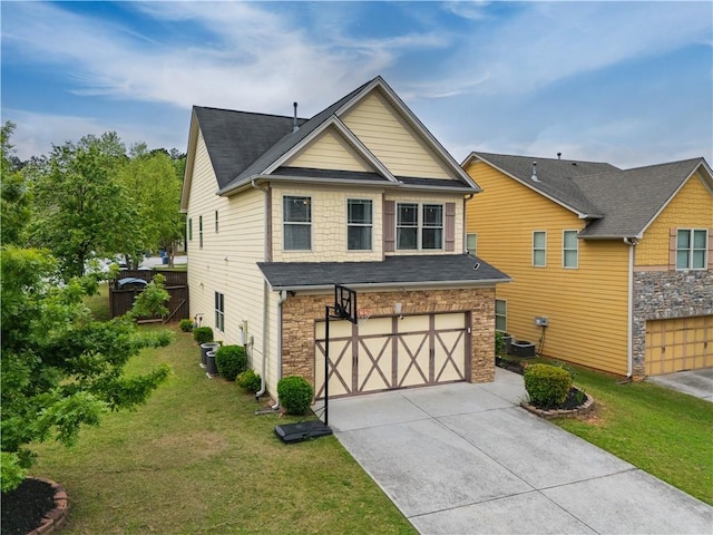 view of front of house with concrete driveway, an attached garage, stone siding, and a front lawn
